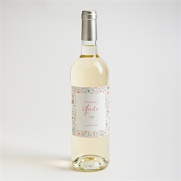 Etiquette de bouteille baptême croix à motifs et pois - Mise en situation